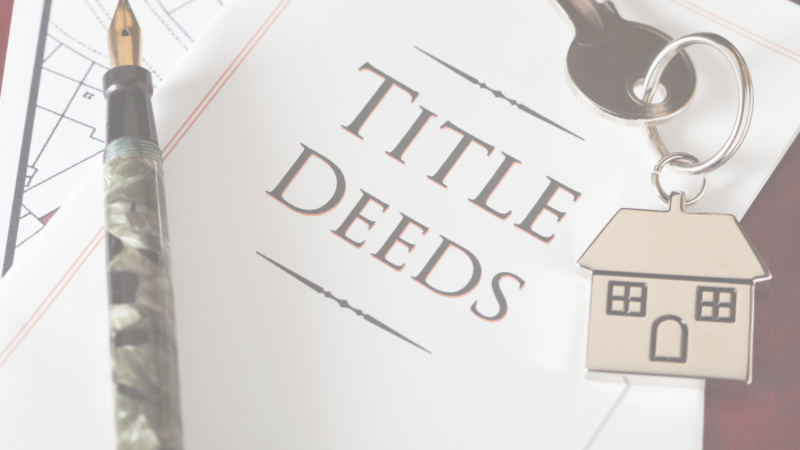Buyer reviewing a Transfer Certificate of Title (TCT), tax declaration, and property documents as part of due diligence before buying real estate in the Philippines